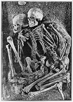 view M0011811: Reproduction of a photograph of two human skeletons of the Upper Paleolithic (Aurignacian burial) discovered in Grotte des Enfants in Italy in 1901, from an unknown publication