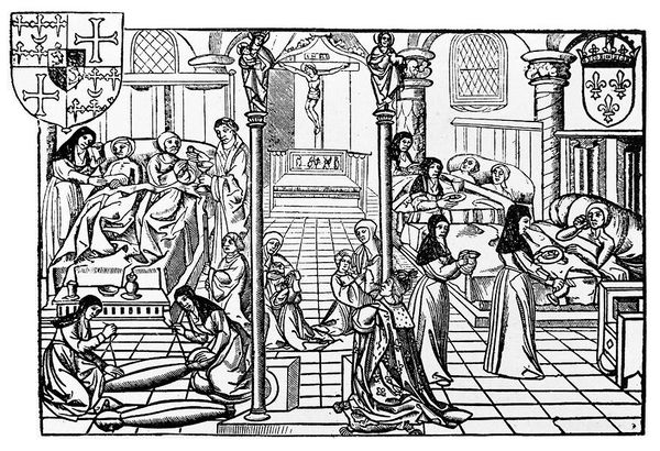 M0013376: Illustration of a medieval hospital ward with religious nursing orders.