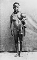view M0013692: A woman carrying a baby in a sling, Andaman Islands