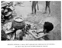 view M0013697: A boy sitting beside a pot containing meat being broiled for a feast, Alor, Indonesia