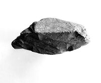 view M0015358: Two views of a prehistoric artefact made in augite-granophyre, from Nailsworth, Gloucestershire