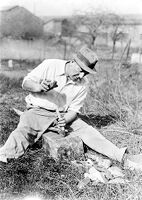 view M0015971: Leon Coutier demonstrating the production of blades by the use of the hammer and punch method