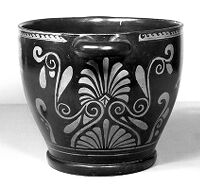 view M0016188EC: Skyphos (wine cup) showing youth with strigil, a woman juggling and palmettes and volutes