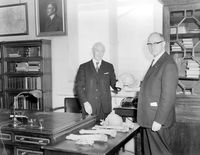 view M0019053: Dr V. Moller-Christensen presenting excavated human remains to Dr Underwood, 1 May 1962